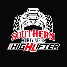 Action shot of a Mega Truck and customized Side-by-Side navigating a deep mud pit at a Southern Bounty Mud Series event